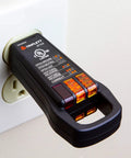 ET102 3-Wire Outlet Tester with Finger Loop plugged into a white wall outlet, black plastic receptacle tester