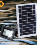Solar Flood Light 2-Pack Dual 42 LED 6500K Dusk To Dawn Security Lighting, IP65 Waterproof, solar panel and light on wet stones