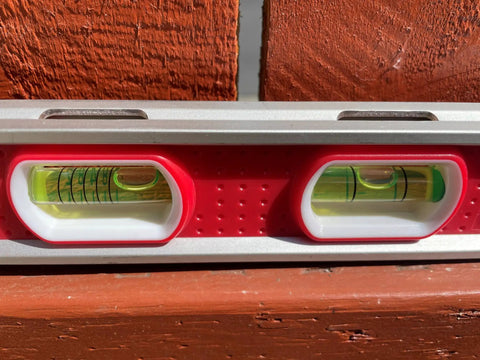 Close-up of two vials on Built Tough 12 Inch Magnetic Toolbox Level With Aluminum Frame, showing level accuracy.