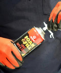 Person using Tough As Nails Expanding Spray Foam Insulation Sealant For Large Gaps And Cracks, 12 Oz Off White Polyurethane.