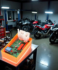 Universal 5 Pin AC CDI Ignition Box With Dual Plug All In One Adjustable CDI Module for go-karts and dirt bikes on a workshop table.
