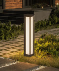 Outdoor Path Light 31.5 Inch Modern Landscape Bollard Lighting For Garden Pathway and Driveway, illuminating a garden path