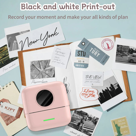 No Sweat Portable Mini Sticker Printer And Slick Inkless Thermal Maker With Effortless Bluetooth Sync For Quick Journaling Labels on a desk with prints.