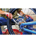 Person using Quarter Inch Drive Ratcheting T Handle Torque Wrench With 20 To 100 Inch Pound Range on bike wheel