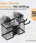 3 In 1 Metal Hair Tool Organizer Wall Mounted Holder For Hair Dryer, Flat Iron, Curling Iron, Straightener And Styling Tools, Bathroom Storage Solution In A Sleek Black Finish demonstrating its load capacity by holding a weight against a tiled wall.