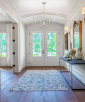 8 Light Rustic Industrial Chandeliers With Brushed Nickel Finish in elegant foyer with natural light and modern decor.