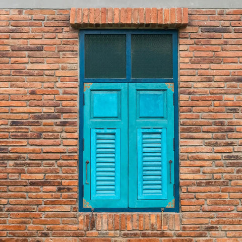 Blue wooden door with brass corner protectors 4 pack heavy duty golden edge guards for boxes and closets wardrobe doors home and office use durable corrosion resistant decorative finish.