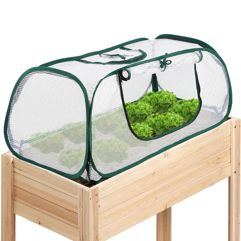 Pack Of 2 Garden Bed Covers 45 By 22 By 16 Inches Plastic Mini Greenhouses for seedling germination and frost protection on a wooden frame.