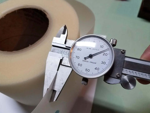 Caliper measuring 4 Inch By Point Zero One Five Inch By 100 Foot Urethane Die Protection Film For Press Brake Protects Stainless Steel And Painted Parts