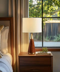 Mid Century Modern Table Lamp With Pecan Wood Base And Gold Metal Accents, White Drum Shade, 26 Inch Tall, Gold Brown Finish, Dope Lighting For Bedroom Nightstand Or Office Desk next to window