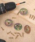 Solid As A Rock Furniture Leg Mounting Plates 4 Pack with screws and drill on wood surface for DIY repair.