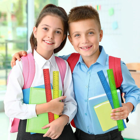 Students in classroom holding 32 Pack Clear Plastic Rulers 12 Inch Bulk For Classroom Use With Inches And Centimeters Transparent Assorted Color Rulers