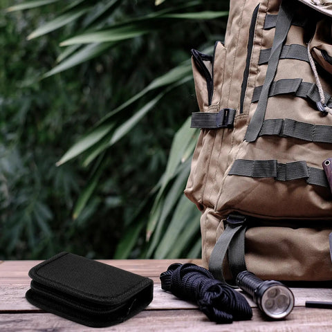 Tactical Survival Sewing Kit With Buttons, Durable Nylon, Compact, shown with rope and flashlight beside a backpack