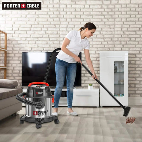Person using Stainless Steel 4 Gallon Wet Dry Shop Vacuum With Lightweight Portable Design Beast Power 4 HP Motor in living room