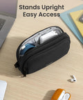 Water Resistant Dual Compartment Tech Pouch For Cables And Gadgets Grab And Go Cable Organizer Bag on a desk, open with items inside.