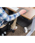 Desk-Friendly 250W Personal Space Heater For Desks And Small Rooms placed under a desk, compact and energy saving design