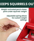 Hand adjusting weight setting on Country House Squirrel Proof Bird Feeder With Weathervane 8 Lb Seed Capacity All Metal Durable Construction.