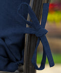 Close-up of tie detail on Comfy Outdoor Chair Cushion Set 21 By 20 Inch Seat With 21 By 24 Inch Back Cushion in Sapphire Blue.