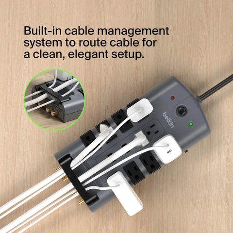 Surge Protector Power Strip With Eight Rotating Outlets And Four Standard Sockets, Eight-Foot Extension Cord, Flat Pivot Plug, 4320 Joules Of Protection For Home Office Travel Desktop And Charging Gear with built-in cable management shown in use on wooden surface.