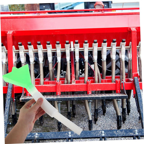 Hand holding Adjustable Seed Tube Kit For Wheat And Corn, Built To Last Sturdy Plastic Seeder Tube, Easy Installation