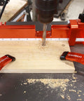 Drill Press Table With Adjustable Aluminum Fence, Flip Stop, And Replaceable Insert For 12 Inch And Larger Drills in use on wood