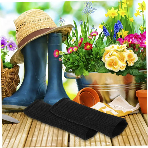 Heavy Duty Cut Resistant Arm Sleeves Built Tough For Serious Yard And Mechanic Jobs Deliver Rock Solid Forearm Protection That Truly Holds Up Through Long Days In Matte Black beside gardening gear.