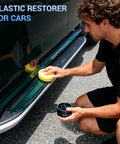 Person applying Ultimate Car Scratch And Trim Restoration Kit For Plastic Vinyl And Rubber Quick 3 In 1 Coating on car side panel