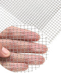 Close-up of hand holding 5 Mesh Stainless Steel Wire Mesh Screen 304 Woven Metal Mesh Keeps Pests Out For Good 8x12 Inch Silver