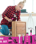 Person using Pink 218-Piece Go-To Home Repair Tool Kit With Wide Mouth Storage Bag For DIY Projects to assemble wooden furniture.