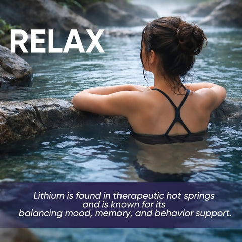 Woman relaxing in a hot spring, showcasing natural lithium sources for mood, memory, behavior support, and relaxation.