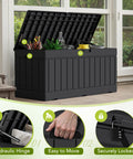 78 Gallon Waterproof Resin Deck Box With Lockable Bench No Fuss Outdoor Storage for garden tools and patio furniture, black resin with rattan pattern, lid open showing plants and decor inside.