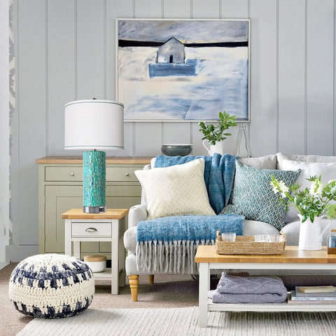 Contemporary living room with a white linen drum shade lamp on a side table, highlighting decor style and functionality.