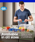 Man sealing 2 Gallon Storage Bags With Double Zipper Seal 60 Count Thick Resealable BPA Free Plastic in kitchen, next to vegetables.