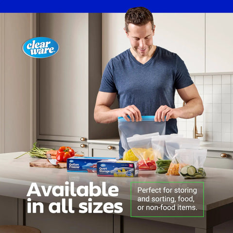 Man sealing 2 Gallon Storage Bags With Double Zipper Seal 60 Count Thick Resealable BPA Free Plastic in kitchen, next to vegetables.