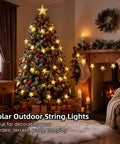 Solar Star String Lights 39Ft Outdoor Waterproof Fairy Lights With 100 LEDs, 8 Modes, Warm White Glow on a decorated tree indoors.