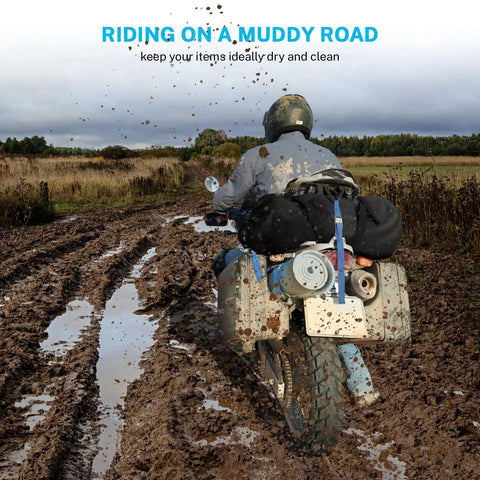 Motorcycle on muddy trail carrying Extra Large Waterproof Duffel Bag 80L With Roll Top Closure And PVC Build