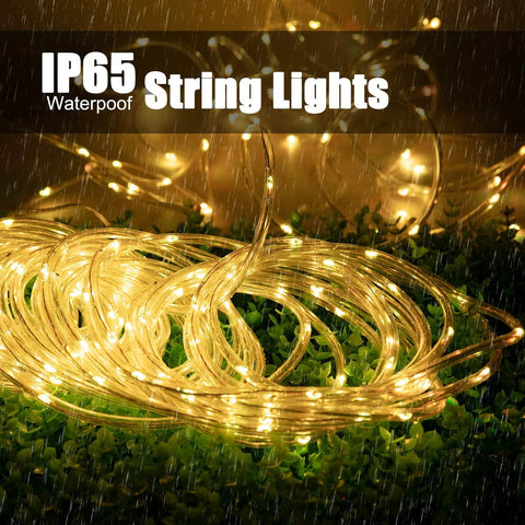 Solar Rope Lights Outdoor 72 Feet 200 LED Waterproof Copper Wire Fairy Lights coiled on grass with IP65 label in rain