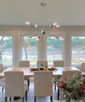 Dining room with 23.6 Inch Sputnik Chandelier With Brushed Nickel 8 Light Ceiling Fixture, adjustable height, modern decor.