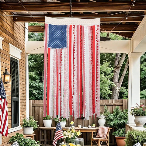 Vintage American Flag Rag Ribbon Banner For Fourth Of July Decor hanging on a porch; 4x2.3 ft size, rustic style.
