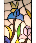 Close-up of Tiffany Style Table Lamp With Iris Flower Butterfly Stained Glass, featuring blue, yellow, and green glass pieces.