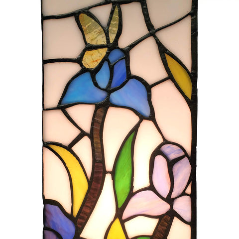Close-up of Tiffany Style Table Lamp With Iris Flower Butterfly Stained Glass, featuring blue, yellow, and green glass pieces.