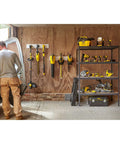 Person organizing tools in workshop, shelves with yellow and black power tools, no visible TR-45 Light-Duty Staple Gun