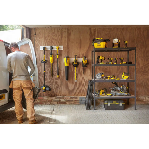 Person organizing tools in workshop, shelves with yellow and black power tools, no visible TR-45 Light-Duty Staple Gun