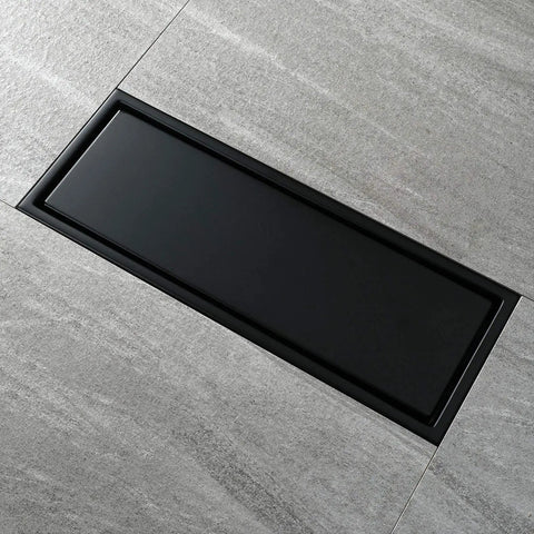 Heavy Duty Stainless Steel Linear Floor Drain With Brushed Gold Finish Anti Odor Tile Insert For Bathroom Shower Hassle Free Removable Hair Catcher Cover Top Shelf Rectangular Design on tiled floor.
