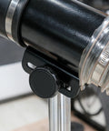Close-up of Deluxe Pro Grade Variable Height Dust Extraction Hood With Flexible Rubber Cuff For Interchangeable Dust Hood And 102mm Hose Connection Compatible With 100mm Hoods Adjustable Stand Capturing Waste From Power Tools And Machinery showing clamp and hose connection.