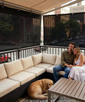 Couple on patio with 50 Percent Shade Cloth 8 Ft By 16 Ft Sun Shade Netting in background, black color, HDPE material installed.