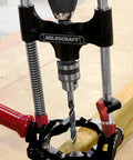 Portable Drilling Guide Attachment For Straight And Angled Holes With Adjustable Angle Readout in use on wood surface
