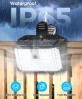 Super Bright 176 Lumen Solar Clip On Fence Lights With Motion Sensor illuminated in rain, showcasing black IP65 waterproof design.