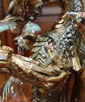 Close-up of Steampunk Dragon Wine Bottle Holder With Two Glasses Metal Gothic Wine Rack, showing detailed dragon scales and glasses.