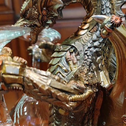 Close-up of Steampunk Dragon Wine Bottle Holder With Two Glasses Metal Gothic Wine Rack, showing detailed dragon scales and glasses.